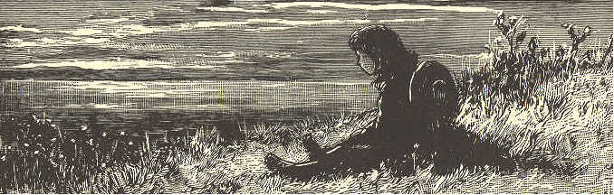 Boy sitting on hillside.