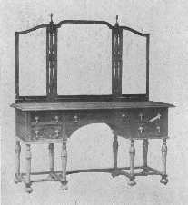 In this walnut dressing-table the period of William and Mary has been adapted to modern needs.