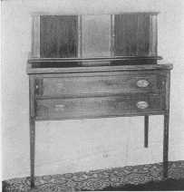 One of Sheraton's charming desks, with sliding doors made of thin strips of wood glued on cloth.