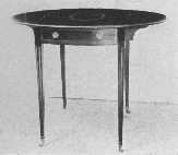 Pembroke tables were made by Hepplewhite. This is a fine example and shows characteristic inlay and the legs sloping on the inside edge only. The flaps fold down and make a small oblong table.