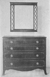 An exceptionally fine reproduction of a Sheraton chest of drawers.