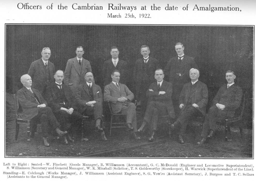 Officers of the Cambrian Railways at the date of Amalgamation, March 25th, 1922.  Left to Right: Seated—W. Finchett (Goods Manager), R. Williamson (Accountant), G. C. McDonald (Engineer and Locomotive Superintendent), S. Williamson (Secretary and General Manager), W. K. Minshall (Solicitor), T. S. Goldsworthy (Storekeeper), H. Warwick (Superintendent of the Line).  Standing—E. Colclough (Works Manager), J. Williamson (Assistant Engineer), S. G. Vowles (Assistant Secretary), J. Burgess and T. C. Sellars (Assistants to the General Manager)