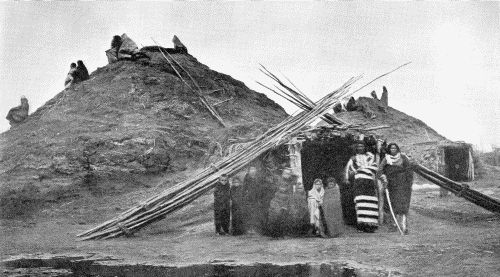 LODGES IN THE PAWNEE VILLAGE WHICH STOOD ON THE LOUPE FORK OF THE PLATTE RIVER  Photograph by W. H. Jackson, 1871