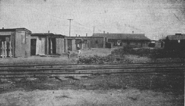 A RAILROAD CAMP FOR IMMIGRANT WORKERS IN A PROSPEROUS SUBURBAN COMMUNITY, 1920