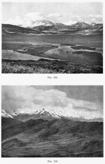 Fig. 134—Southwestern aspect of the Cordillera Vilcapampa between Anta and Urubamba from Lake Huaipo. Rugged summit topography in the background, graded post-mature slopes in the middle distance, and solution lake in limestone in the foreground.