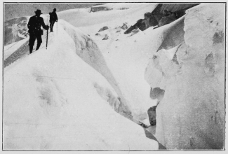 A great crevasse in the upper snow fields.  To face p. 137.