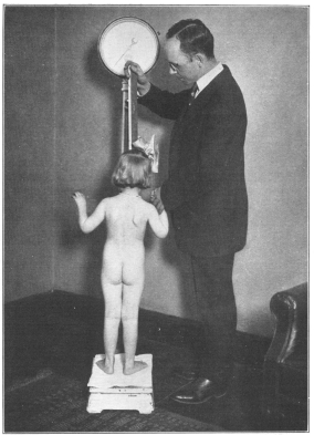 Photo, Paul Thompson   THE WEIGHT TEST IN A CHILD’S PHYSICAL EXAMINATION TO DETERMINE HOW NEARLY IT APPROACHES CORRECT STANDARDS OF PHYSICAL DEVELOPMENT