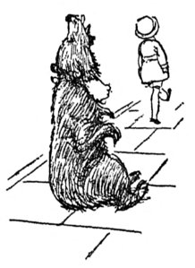 [Boy walking away from bear sitting on a line]