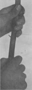 Fig. 3. Second operation. Making vertical cut between
parallel cuts on stock.