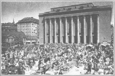 
THE CONCERT HALL IN STOCKHOLM. BEFORE IT IS THE OPEN MARKET. EVERY
SWEDISH CITY HAS ITS OPEN MARKET
