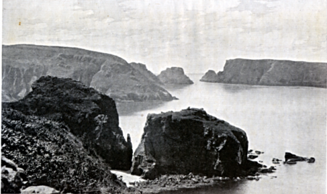 TINTAGEU. The great detached rock in foreground is TINTAGEU; to the left, the altar rock on which Phil used to lie; the bay behind is PORT A LA JUMENT with BELFONTAINE in the cliffs at the head of it; in the foreground THE GOULIOT ROCKS and PASSAGE; on the right BRECQHOU.