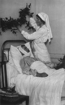 Nurse hanging evergreens