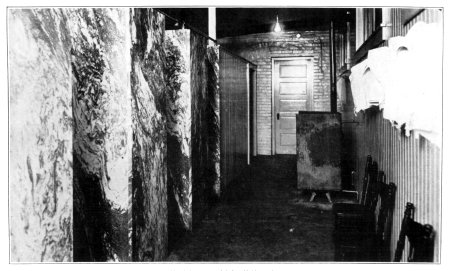 Shower baths installed in an old building in a crowded section.