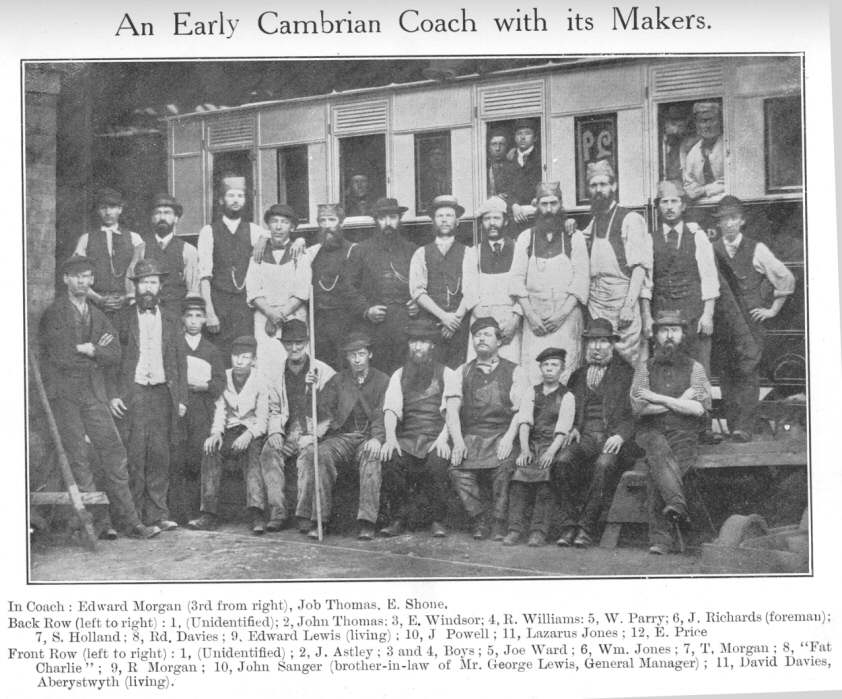 An Early Cambrian Coach with its Makers.  In Coach: Edward Morgan (3rd from right), Job Thomas, E. Shone.  Back Row (left to right): 1, (Unidentified); 2, John Thomas; 3, E. Windsor; 4, R. Williams: 5, W. Parry; 6, J. Richards (foreman); 7, S. Holland; 8, Rd. Davies; 9, Edward Lewis (living); 10, J. Powell; 11, Lazarus Jones; 12, E. Price.  Front Row (left to right): 1 (Unidentified); 2, J. Astley; 3 and 4, Boys; 5, Joe Ward; 6, Wm. Jones; 7, T. Morgan; 8, “Fat Charlie”; 9, R. Morgan; 10, John Sanger (brother-in-law of Mr. George Lewis, General Manager); 11, David Davies, Aberystwyth (living)