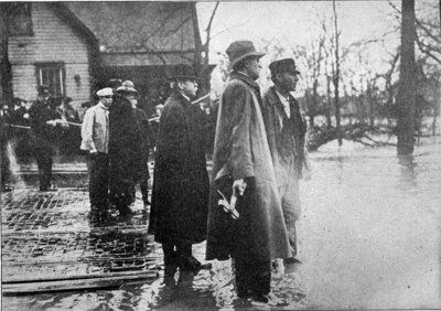 President John H. Patterson, of the National Cash Register Company, third man from the right, directing the work of rescue at Dayton, Ohio. Through his magnificent skill as an organizer, and his coolness of mind, scores of lives were saved that would otherwise have been lost, and a great deal of suffering was alleviated by his prompt measures of relief