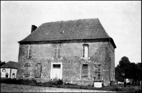 A large house, with wooden shutters covering the lower windows