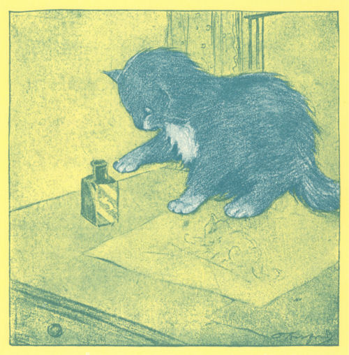 A kitten reaches a paw towards an open ink bottle on a desk