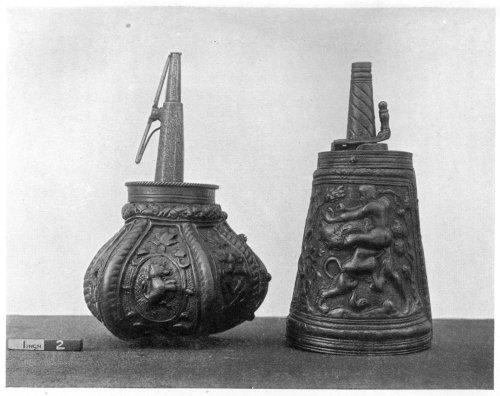 FIG. 94.—OLD POWDER FLASKS.  (In the Victoria and Albert Museum.)