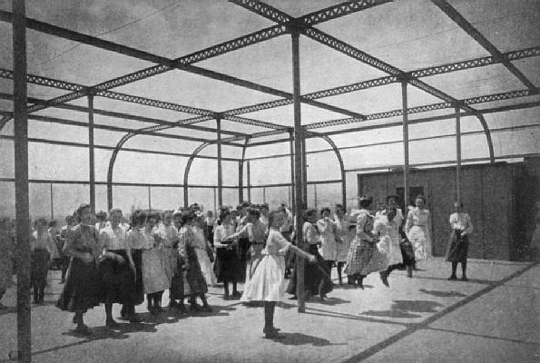 plate: JUMPING ROPE ON THE ROOF PLAYGROUND OF A PUBLIC SCHOOL