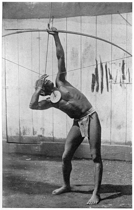 MAN FROM NITENDI, STA CRUZ, WITH ORNAMENTAL BREASTPLATE.