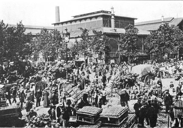 THE HALLES CENTRALES, PARIS  An Outside View, Showing How the Supplies Overflow into the Adjacent Streets, Notwithstanding the Provision of Twenty-two Acres of Covered Pavilions.