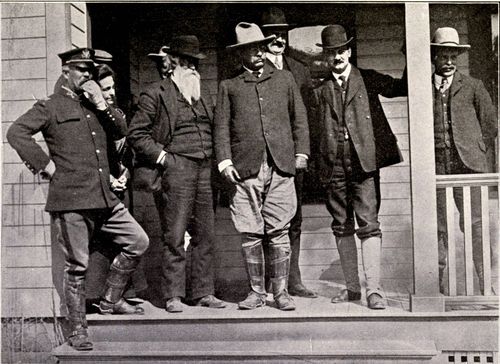 THE PRESIDENT WITH MR. BURROUGHS AND SECRETARY LOEB JUST BEFORE ENTERING THE PARK.  From stereograph, copyright 1906, by Underwood & Underwood, New York.