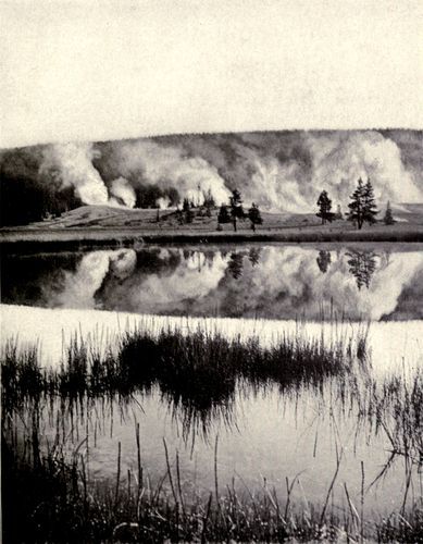 SUNRISE IN YELLOWSTONE PARK.  From stereograph, copyright 1904, by Underwood & Underwood, New York.