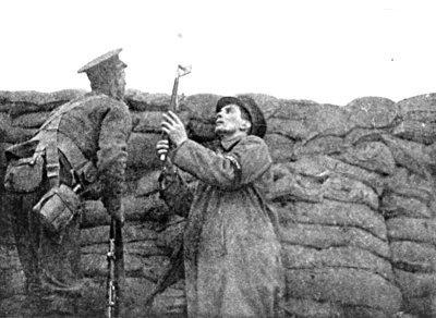 CHOOSING A POSITION FOR MY CAMERA IN THE FRONT LINE TRENCH AT PICANTIN, WITH THE GUARDS. WINTER, 1915-16