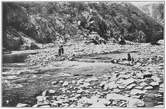 Fisherman examining his ob-o′-fu