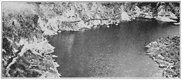 Irrigating ditch which feeds the troughs secured to the mountain side shown at the left