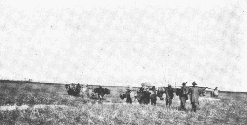 Eld. Steigerwald and Mr. Doner with Carriers on Their Trip North of Macha.