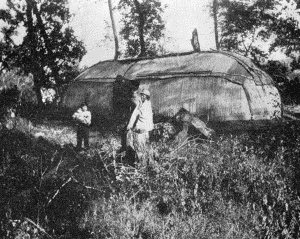 b. Long structure with entrance on one side  WINNEBAGO HABITATIONS, ABOUT 1870