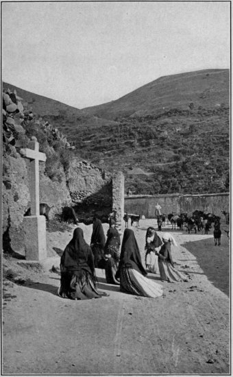 Copyright, 1910, by Underwood & Underwood  A Roadside Scene in Spain