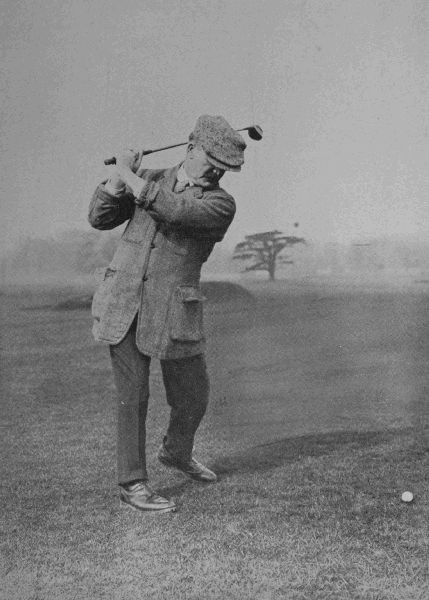 PLATE V.  J. H. TAYLOR  At the top of his swing in the drive. Note here the position of Taylor's wrists. This is a matter of the utmost importance. Taylor is at times inclined to get a little on to his right leg, but probably here the weight is at least equally distributed, if not mainly on the left.