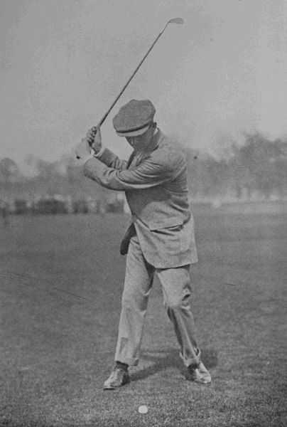 PLATE XIV.  J. SHERLOCK  Top of swing in iron-shot. Note the position of the ball, and the upright swing of the club.