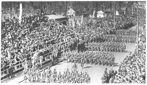 The Harvard University Regiment marching through the streets of Boston