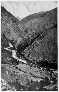 From the sugar cane, Urubanba Valley, at Colpani. On the northeastern border of the Cordillera Vilcapampa looking upstream. In the extreme background and thirteen sixteens of an inch from the top of the picture is the sharp peak of Salcantay. Only the lower end of the more open portion of the Canyon of Torontoy is here shown. There is a field of sugar cane in the foreground and the valley trail is shown on the opposite side of the river.