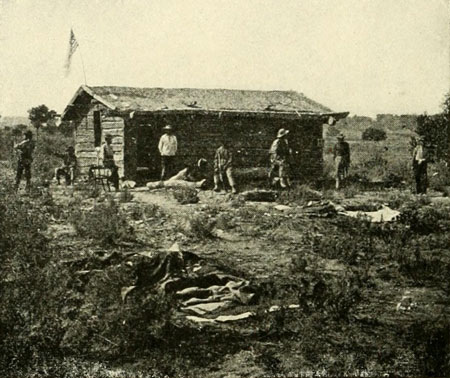 Men of the 1871 Expedition of an Abandoned Cabin Opposite the Mouth of the Uinta River.