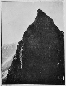 A party ascending the Aiguilles Rouges (Arolla). The people can be seen on the sky-line to the left, at the top of the white streak. By Mr. Leonard Rawlence.