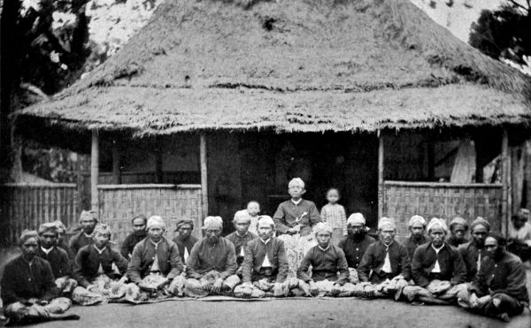 A native official and his followers.