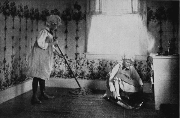 girl mopping the floor anohter girl cleaning the floor