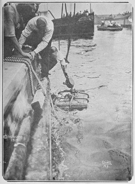 Packing case containing six hundred pounds of iron weights and Houdini, as it was dropped into New York Bay