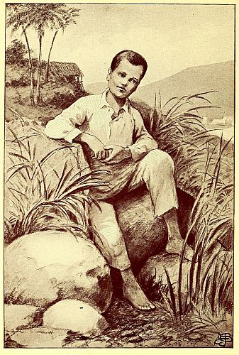 Boy sitting on rocks