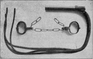 WHIP AND MANACLES USED IN RUSSIAN CONVICT PRISONS.  (In Possession of H. de Windt, Esq.)