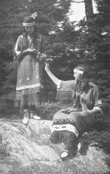 JANE AND ELENA COLLECTING BUTTERFLIES.