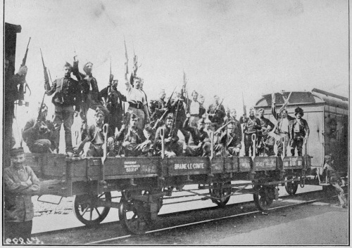 BELGIAN SOLDIERS LEAVING FOR THE FRONT. ALL KINDS OF ROLLING STOCK WERE REQUISITIONED FOR THIS PURPOSE.  Photo by International News Service.