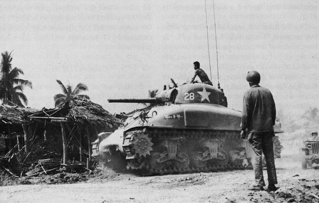 FILIPINO CIVILIAN GUIDES U.S. TANK to Japanese positions in Julita.