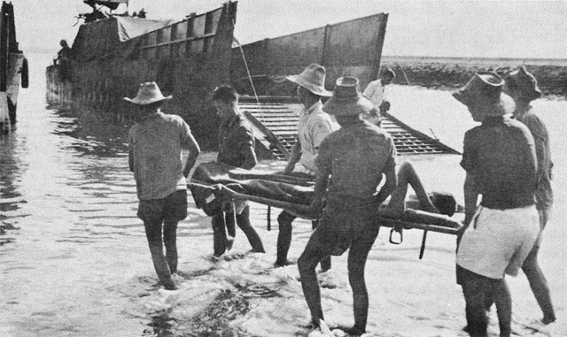 A CASUALTY IS EVACUATED BY SHIP TO A REAR AREA