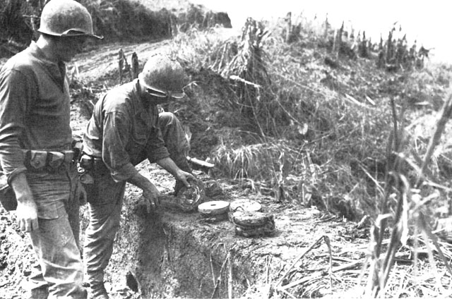 ENGINEERS REMOVE LAND MINES from a bridge on Breakneck Ridge.