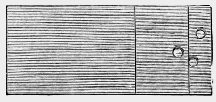 oblong board with three holes in the right side